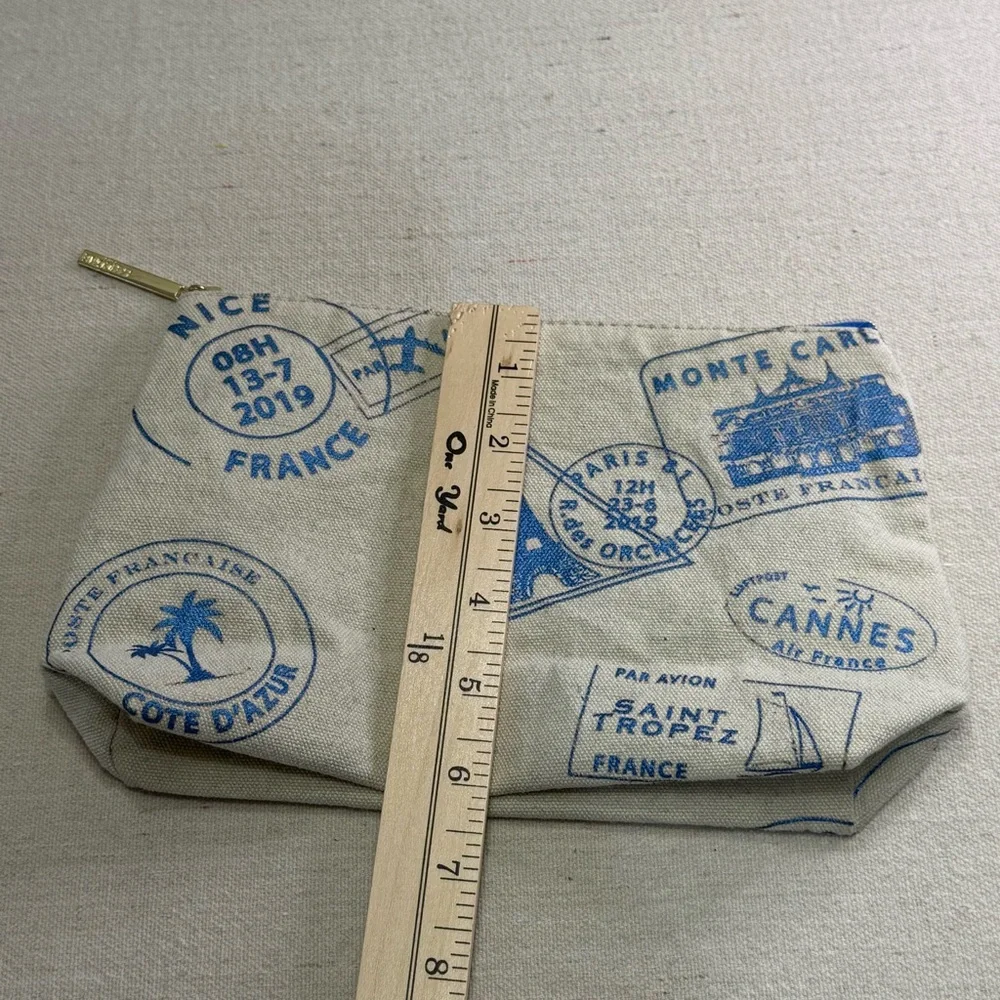 Lancôme Paris canvas cosmetic bag - blue passport stamp design